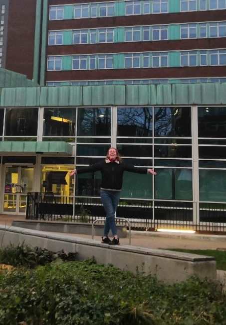 Cate Holder outside university building