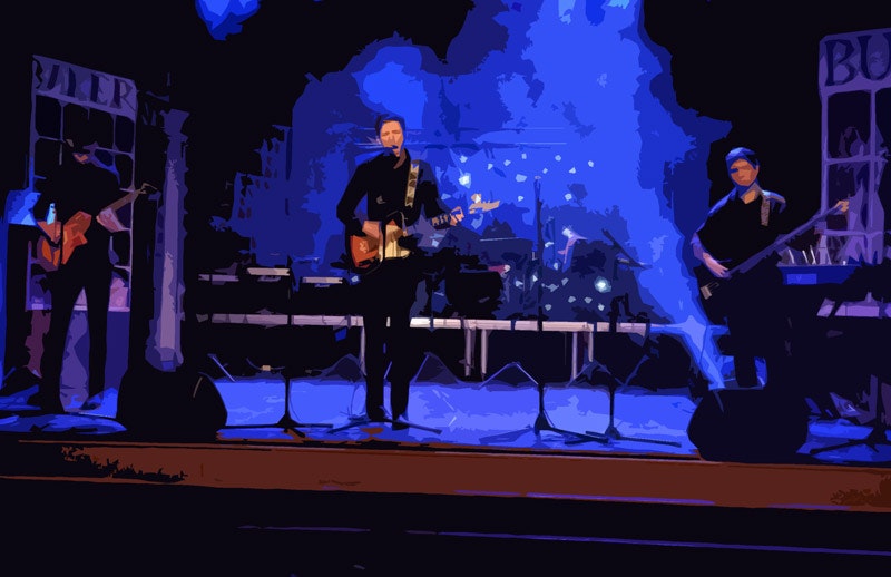 Stylised image of band playing on stage