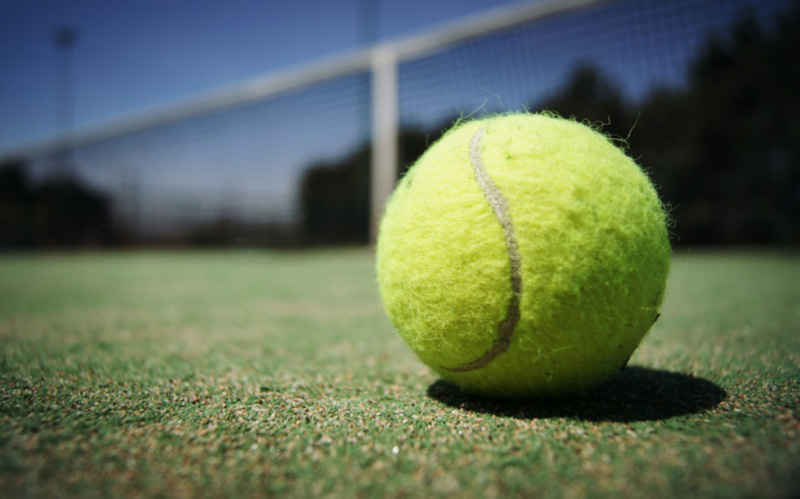 Tennis ball on tennis court